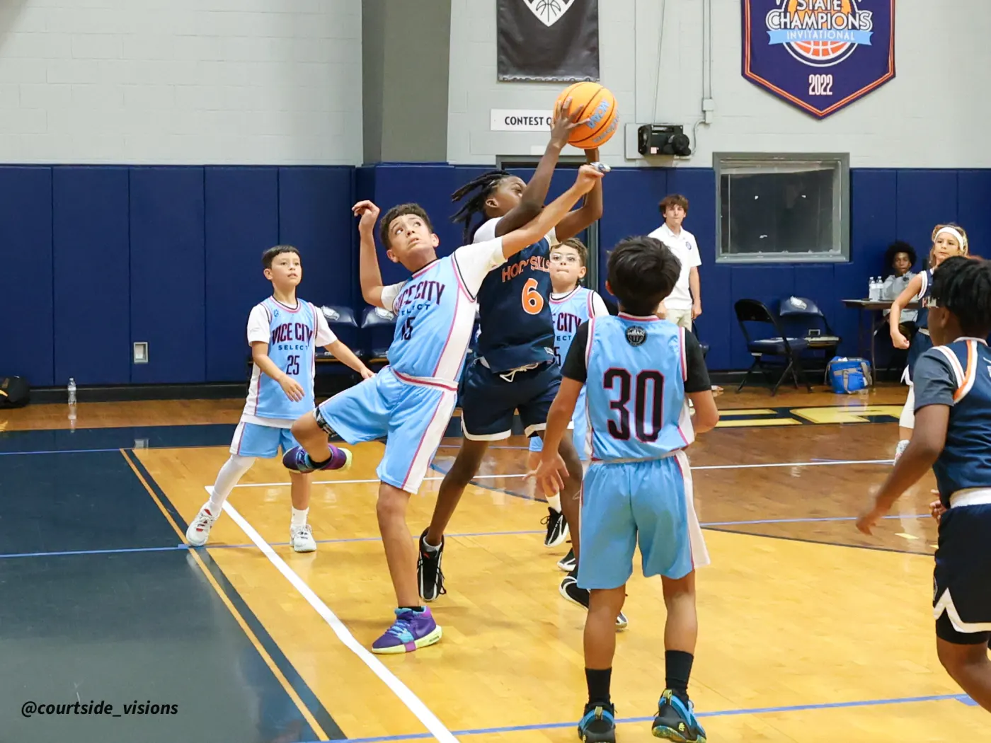 Youth game action under the basket
